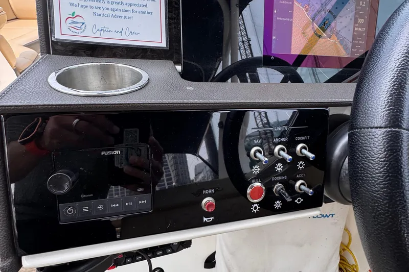 Slide: The Image of Control panel of a 2020 Sea Ray boat with navigation and audio system. - 14