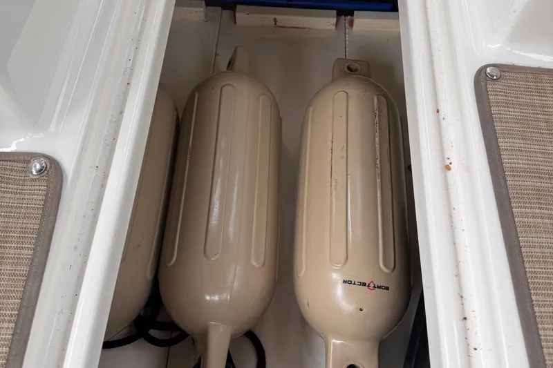 Slide: The Image of Boat fenders stored in a 2020 Sea Ray compartment. - 20