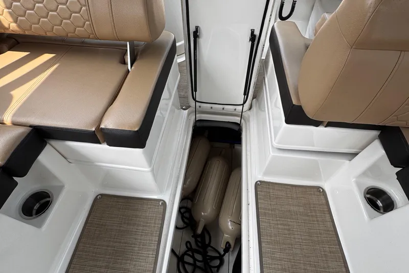 Slide: The Image of 2020 Sea Ray boat interior with tan seating and storage compartment. - 21