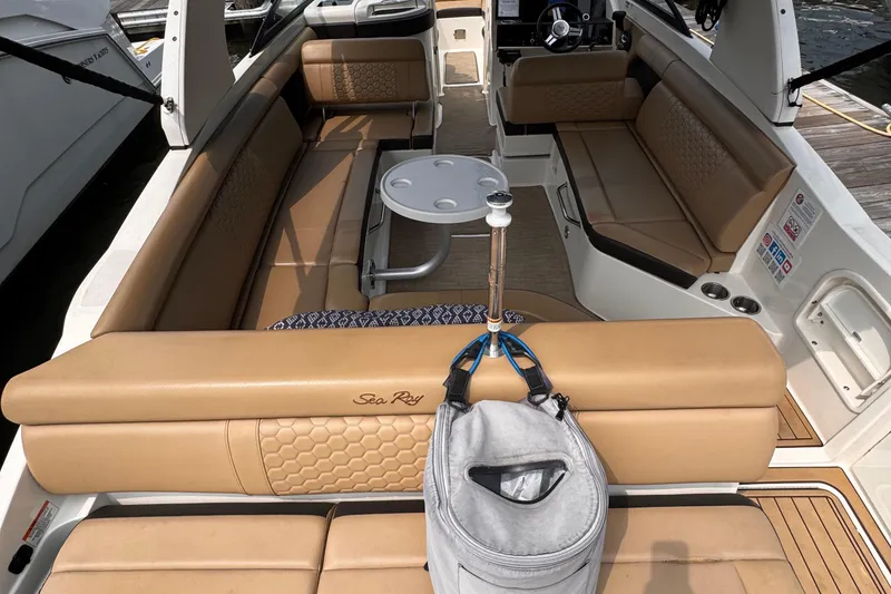 Slide: The Image of 2020 Sea Ray boat interior with tan seating and a small round table. - 7