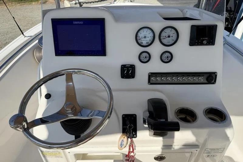 Slide: The Image of 2020 Tidewater 198 CC Adventure boat dashboard with steering wheel, gauges, and controls. - 15