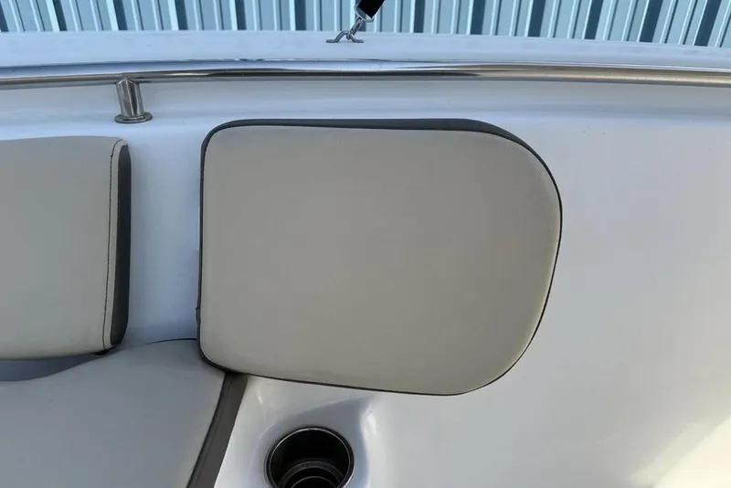 Slide: The Image of 2020 Tidewater 198 CC Adventure boat interior with cushioned seating and cup holder. - 16