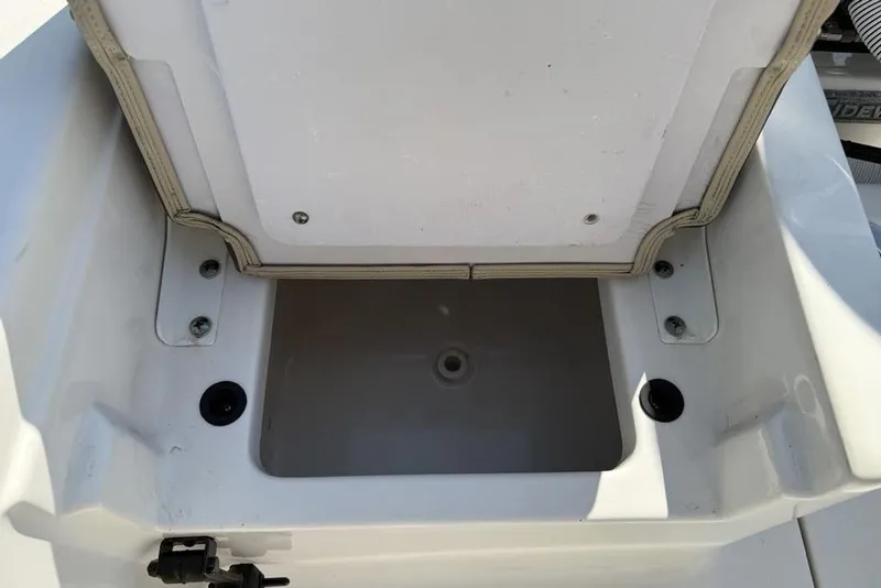 Slide: The Image of Open storage compartment on a 2020 Tidewater 198 CC Adventure boat. - 21