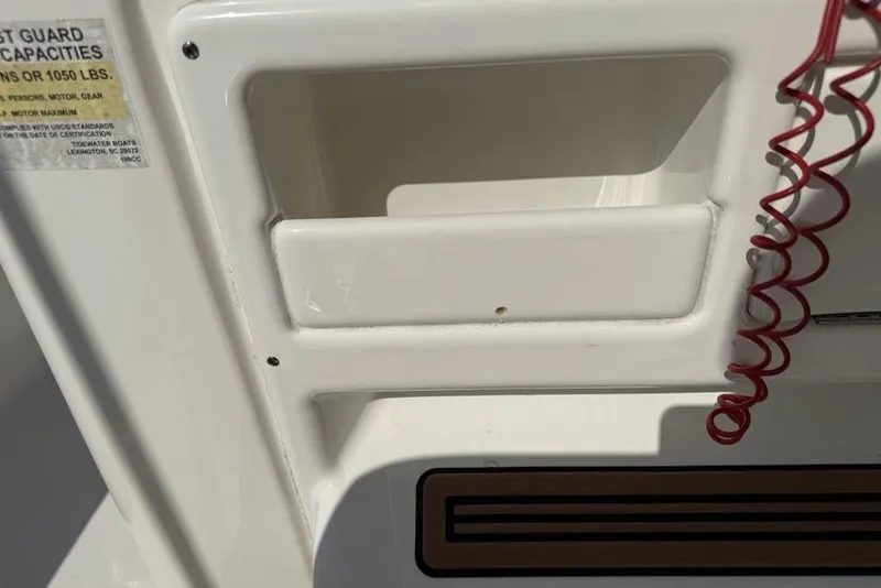 Slide: The Image of 2020 Tidewater 198 CC Adventure boat interior detail with red coiled cord. - 26