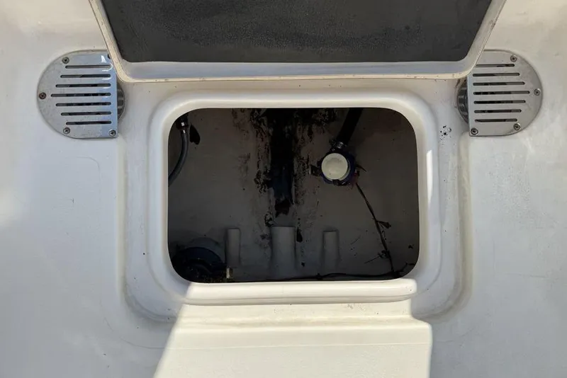 Slide: The Image of Open storage compartment on a 2020 Tidewater 198 CC Adventure boat. - 27