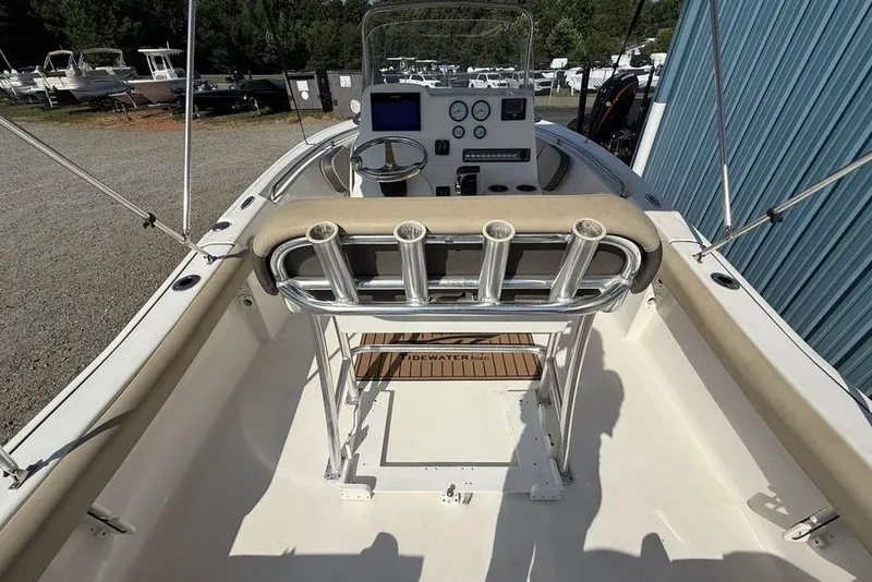 Slide: The Image of 2020 Tidewater 198 CC Adventure boat interior with steering console and rod holders. - 28
