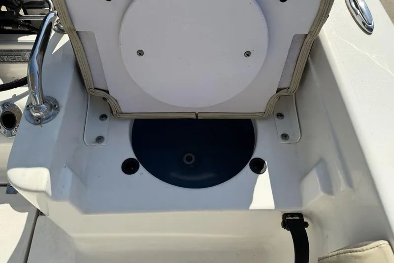 Slide: The Image of 2020 Tidewater 198 CC Adventure boat interior with storage compartment open. - 32