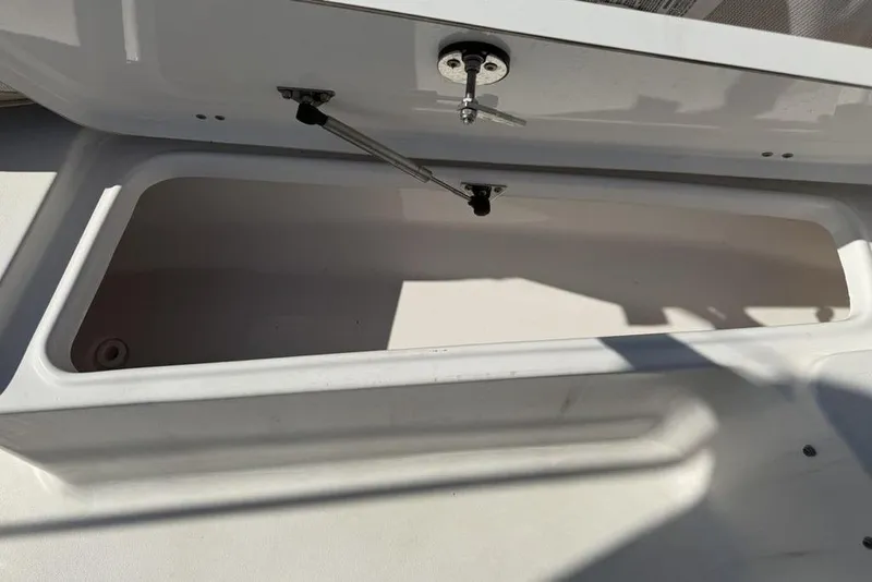 Slide: The Image of Open storage compartment on a 2020 Tidewater 198 CC Adventure boat. - 5