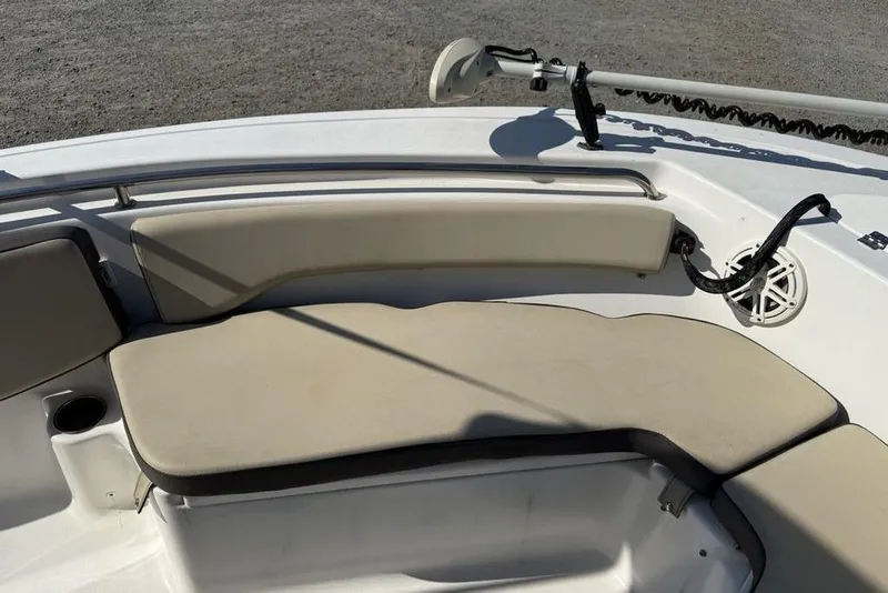 Slide: The Image of 2020 Tidewater 198 CC Adventure boat interior with cushioned seating and cup holder. - 6