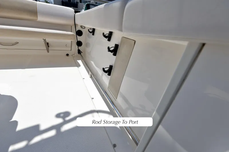Slide: The Image of 2016 Robalo R222 Center Console boat with rod storage to port side. - 11