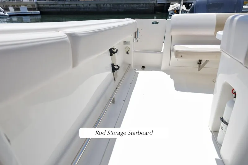Slide: The Image of 2016 Robalo R222 Center Console boat with starboard rod storage. - 12