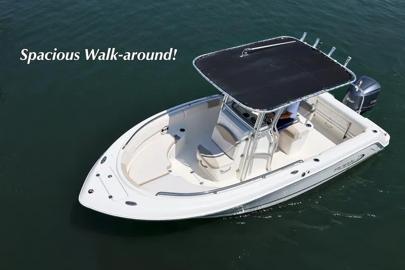 Slide: The Image of 2016 Robalo R222 Center Console boat with spacious walk-around deck on water. - 4