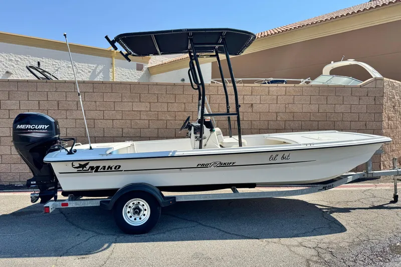 The Image of 2017 Mako Pro Skiff 17 CC boat with Mercury engine on trailer. - 0
