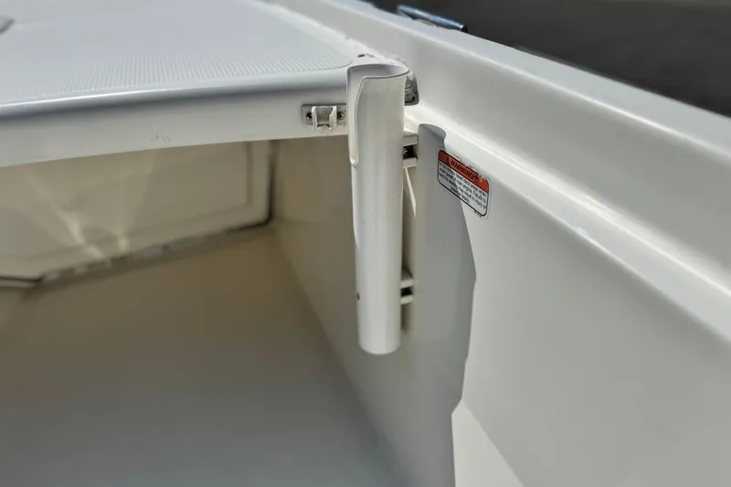 Slide: The Image of 2017 Mako Pro Skiff 17 CC interior detail with rod holder and warning label. - 10