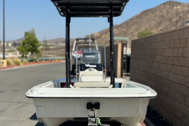 Slide: The Image of 2017 Mako Pro Skiff 17 CC boat parked on a sunny day. - 2