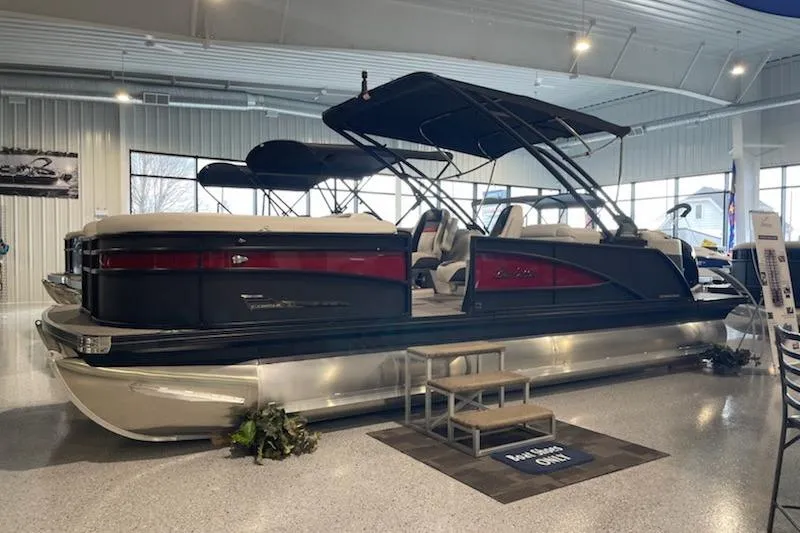 Slide: The Image of 2022 Barletta Corsa Arch 230 pontoon boat displayed in a showroom. - 3