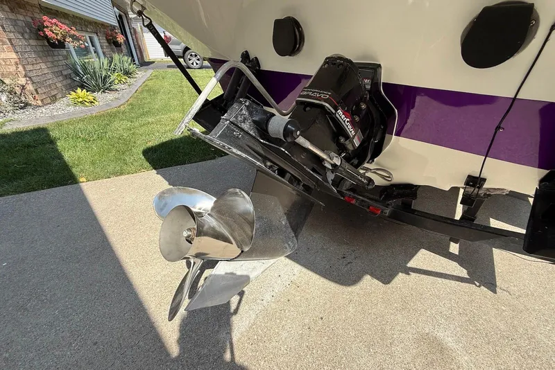 Slide: The Image of Rear view of a 1995 Checkmate Persuader 261 boat with a shiny propeller. - 23