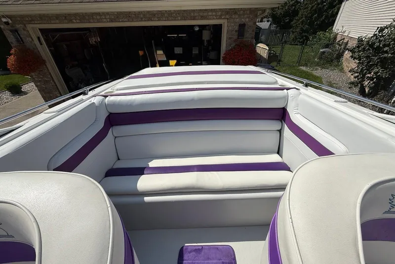 Slide: The Image of 1995 Checkmate Persuader 261 boat interior with white and purple seating. - 29