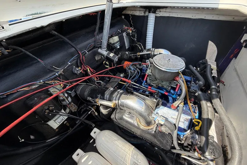Slide: The Image of Engine compartment of a 1995 Checkmate Persuader 261 boat, showcasing detailed wiring and components. - 38
