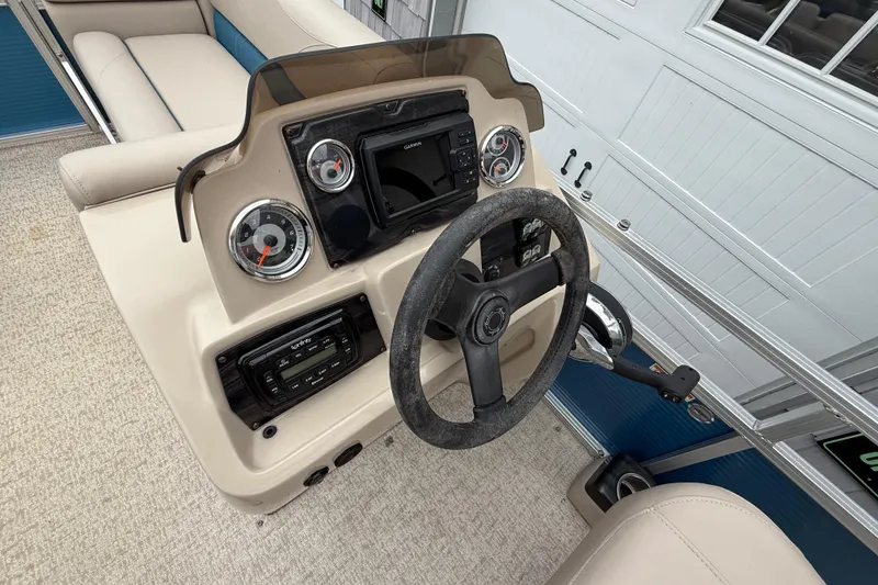 Slide: The Image of Steering console of 2020 Avalon Venture Cruise 18' pontoon boat with gauges and controls. - 20