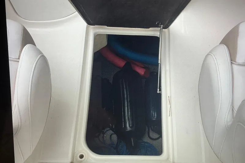 Slide: The Image of 2019 Robalo R207 Dual Console boat storage compartment with fenders and accessories. - 19
