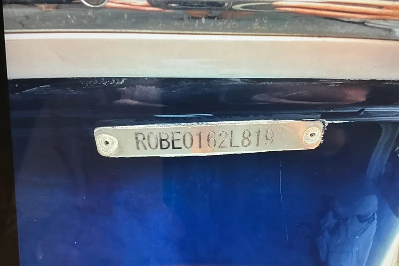 Slide: The Image of 2019 Robalo R207 Dual Console boat identification plate with serial number. - 23