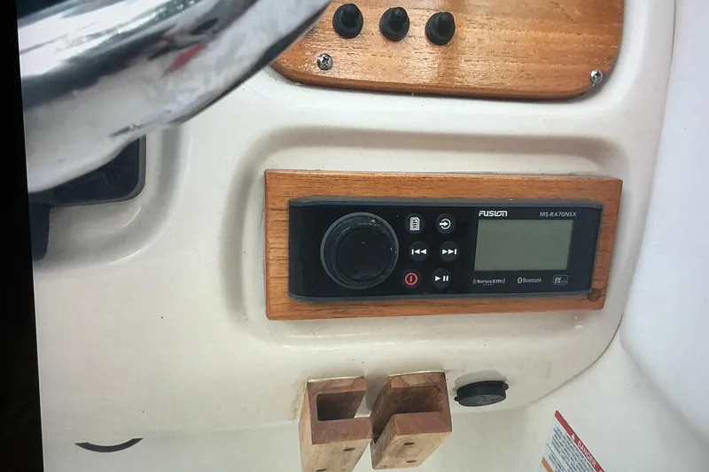 Slide: The Image of 2019 Robalo R207 Dual Console dashboard with Fusion MS-RA70NSX stereo system. - 26