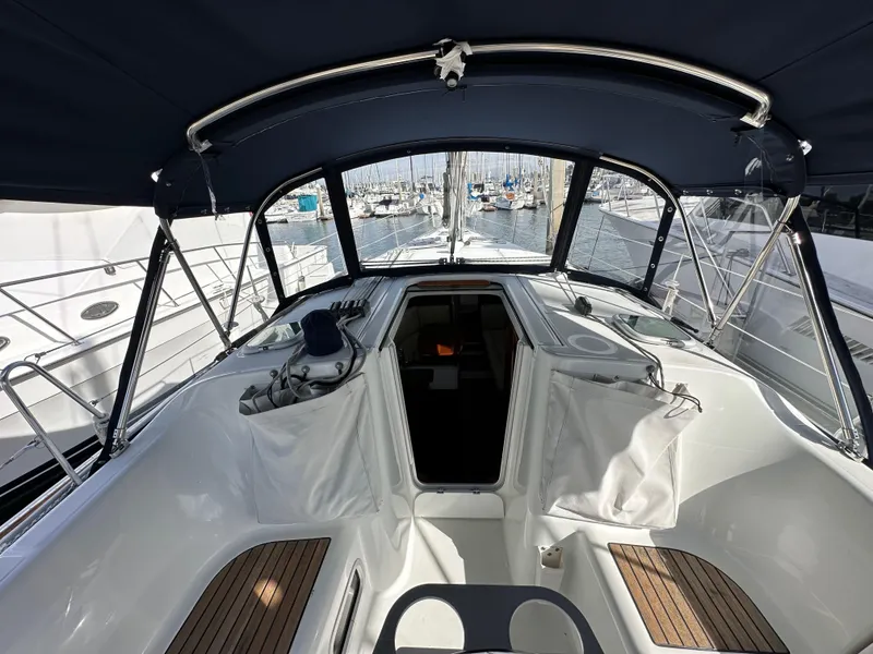 Slide: The Image of 2005 Beneteau 373 sailboat cockpit with canopy, docked at marina. - 15