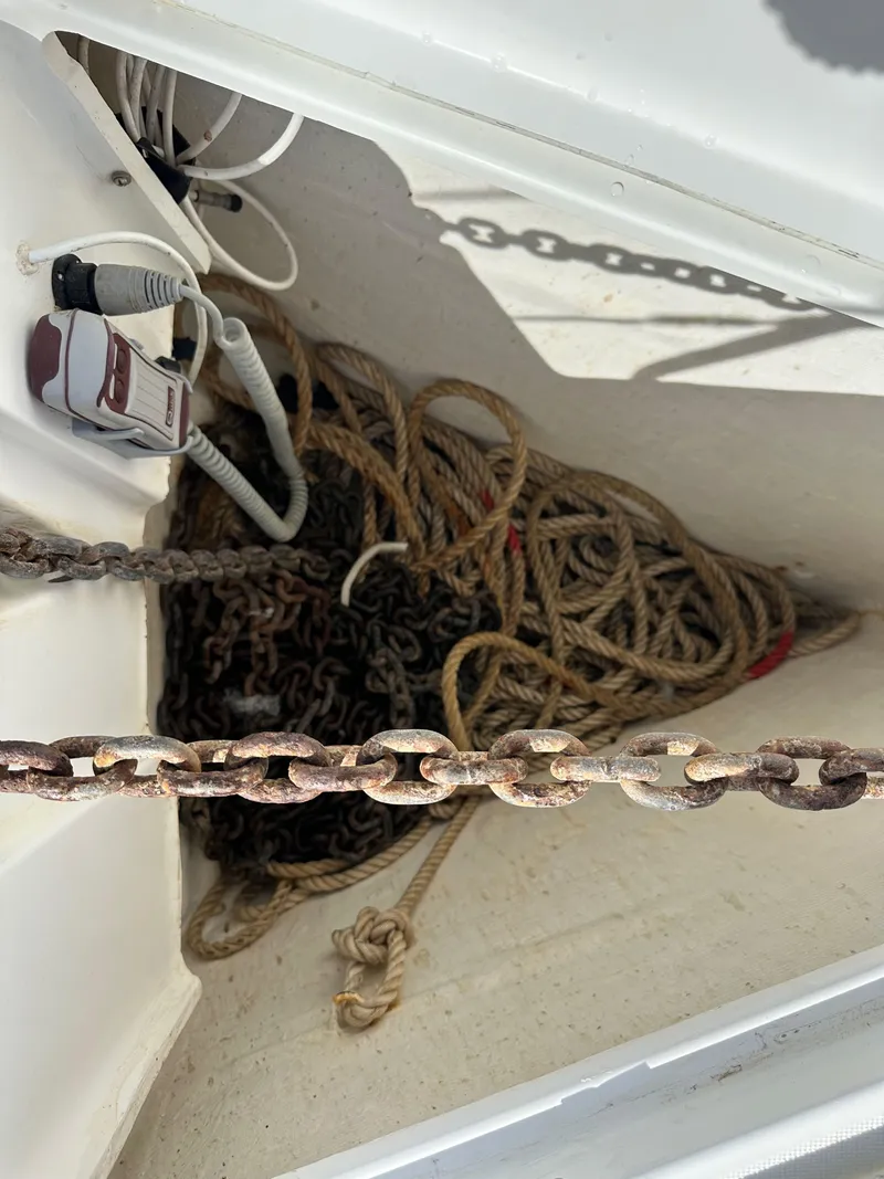 Slide: The Image of Anchor chain and ropes in a 2005 Beneteau 373 sailboat's storage compartment. - 21