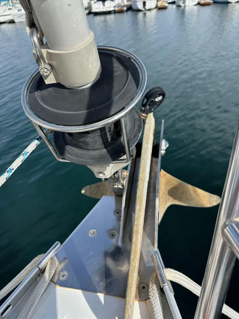 Slide: The Image of Bow of 2005 Beneteau 373 sailboat with anchor and furler, docked in marina. - 22