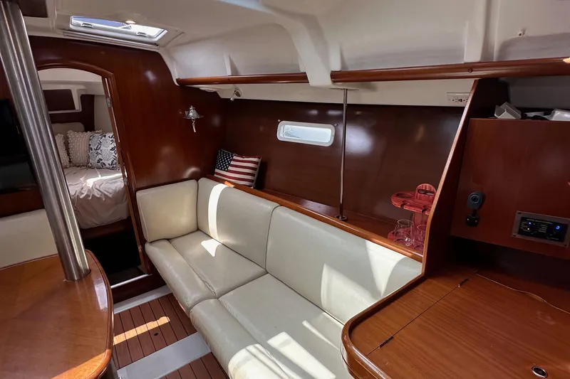 Slide: The Image of Interior of 2005 Beneteau 373 sailboat with cozy seating and elegant wood finish. - 75