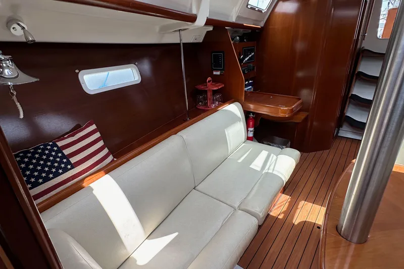Slide: The Image of Interior of 2005 Beneteau 373 sailboat with cozy seating and wooden finishes. - 76