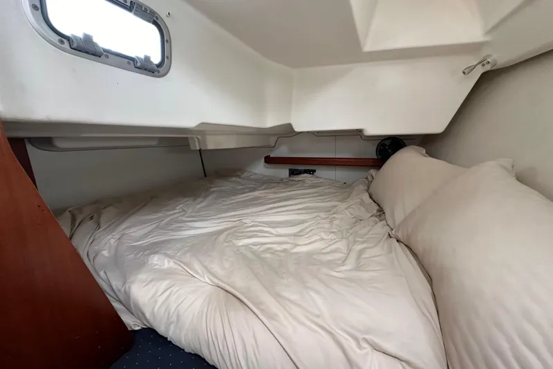 Slide: The Image of Cozy cabin interior of 2005 Beneteau 373 sailboat with comfortable bedding. - 80