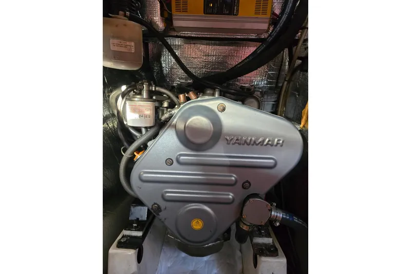 Slide: The Image of Yanmar engine inside a 2005 Beneteau 373 sailboat, showcasing mechanical components. - 87