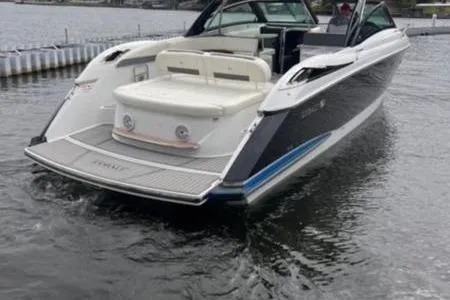 Slide: The Image of 2019 Cobalt A40 boat on water, rear view with seating and swim platform. - 10