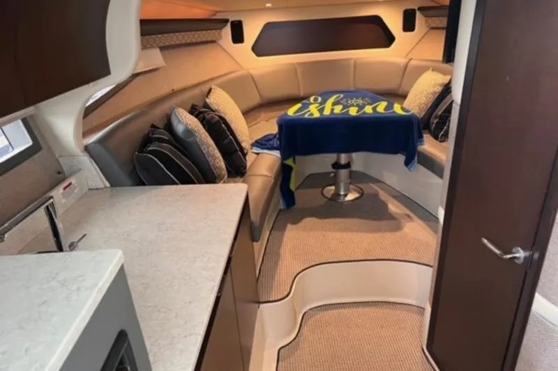 Slide: The Image of 2019 Cobalt A40 interior with cozy seating and table, featuring modern design elements. - 3