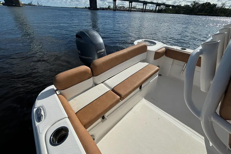Slide: The Image of 2018 Sea Fox 226 Commander boat with tan seating and Yamaha 200 engine. - 17