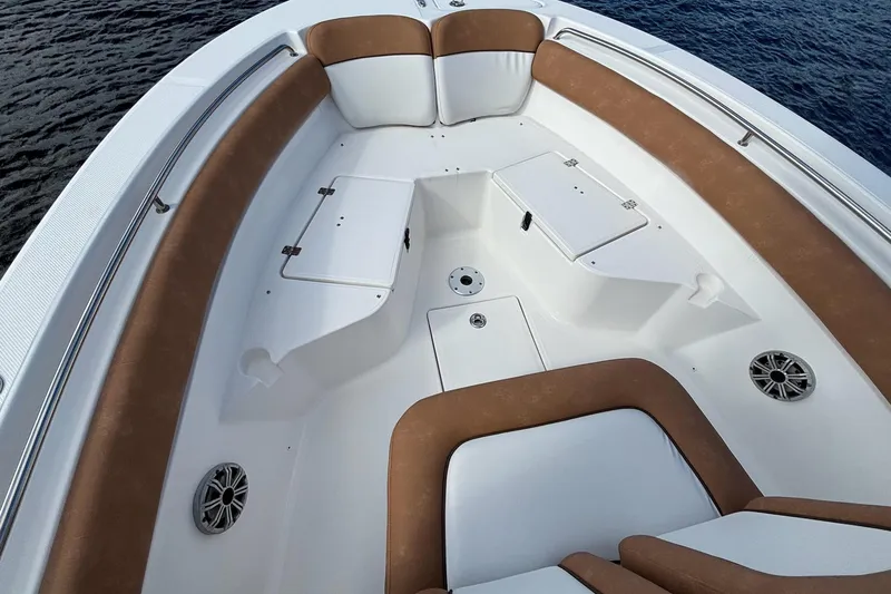 Slide: The Image of 2018 Sea Fox 226 Commander boat interior with cushioned seating and storage compartments. - 18