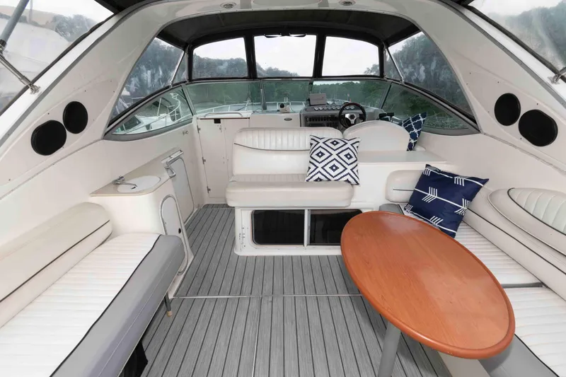 Slide: The Image of 2006 Maxum 3300 SE yacht interior with seating, table, and nautical decor. - 4