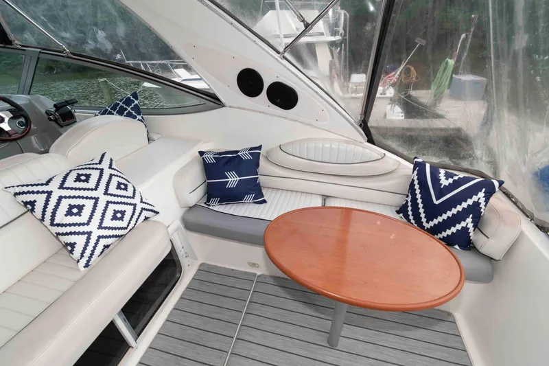 Slide: The Image of 2006 Maxum 3300 SE boat interior with stylish seating and decorative cushions. - 6