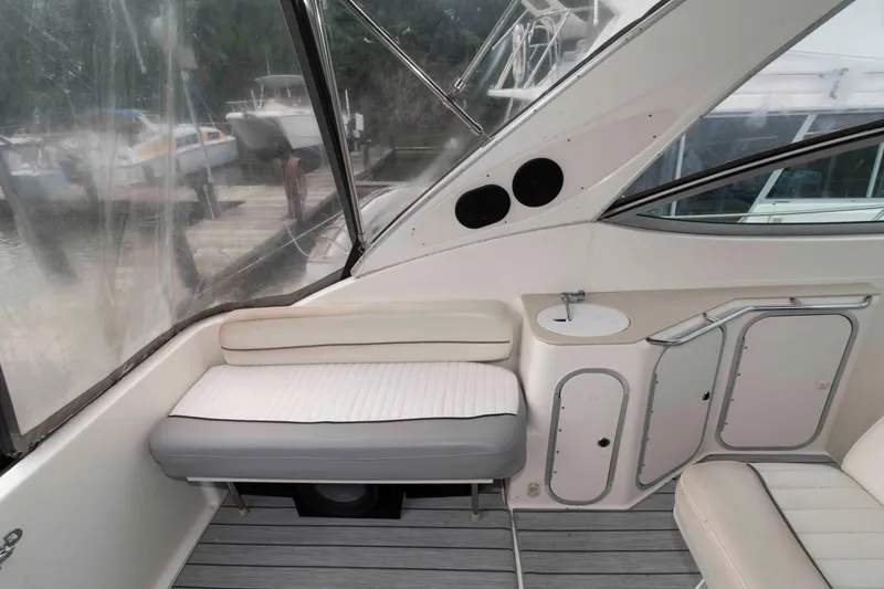 Slide: The Image of 2006 Maxum 3300 SE boat interior with seating and small sink area. - 7