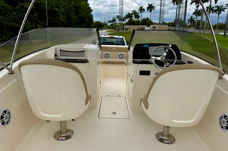 Slide: The Image of 2023 Scout 215 Dorado boat interior with dual seats and steering console. - 12