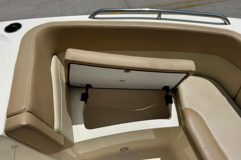 Slide: The Image of 2023 Scout 215 Dorado boat seat with open storage compartment. - 30
