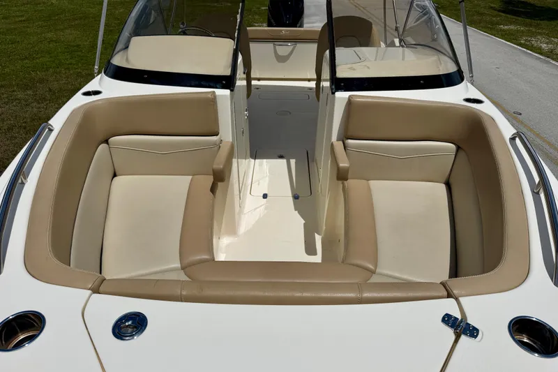 Slide: The Image of 2023 Scout 215 Dorado boat interior with beige seating and sleek design. - 7