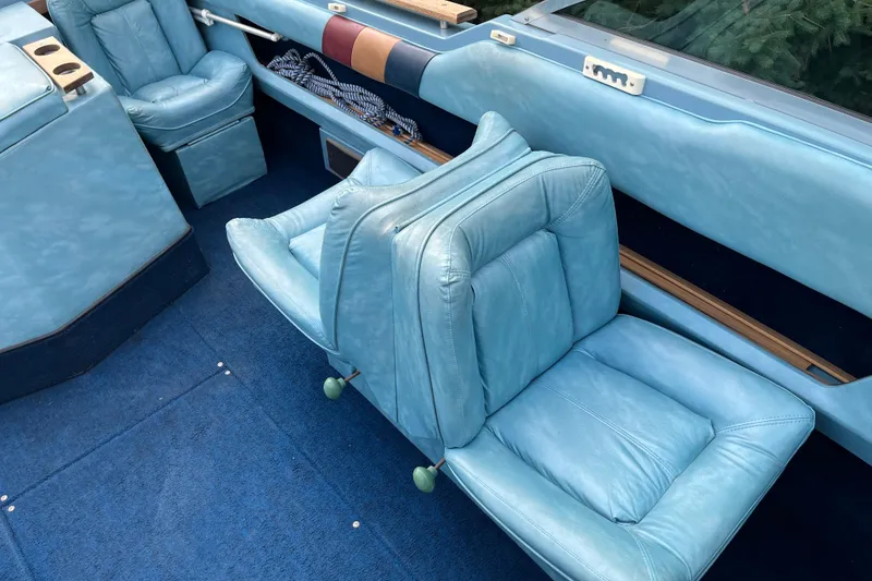 Slide: The Image of Interior of 1983 Century 3000 Bowrider with blue leather seats and carpet. - 7