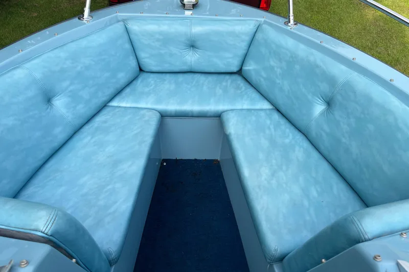 Slide: The Image of 1983 Century 3000 Bowrider with blue cushioned seating in the bow area. - 9