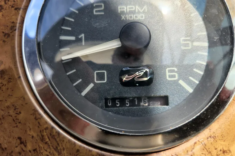 Slide: The Image of Tachometer of 1999 Sea Ray 310 Sundancer showing 5516 RPM. - 13