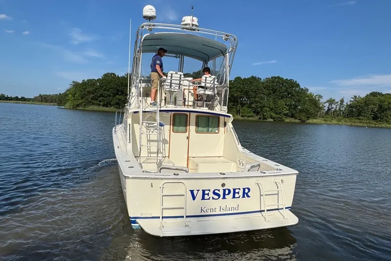 Slide: The Image of 1987 Bertram 33 Sport Fisherman boat "VESPER" on water near Kent Island. - 3