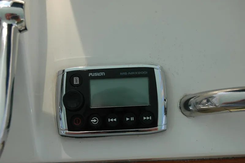 Slide: The Image of Fusion MS-NRX200i marine stereo on 1987 Bertram 33 Sport Fisherman boat dashboard. - 38