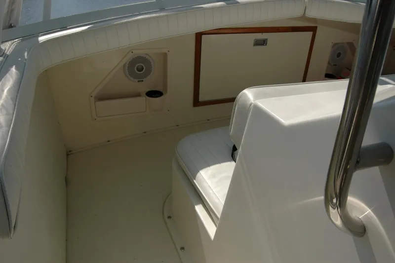 Slide: The Image of 1987 Bertram 33 Sport Fisherman interior with white seating and speaker system. - 42
